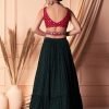 Dark Green Embellished Tiered Lehenga Set With Contrast Blouse And Dupatta